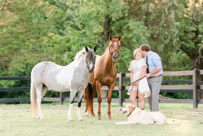 Couple with their horses and dog