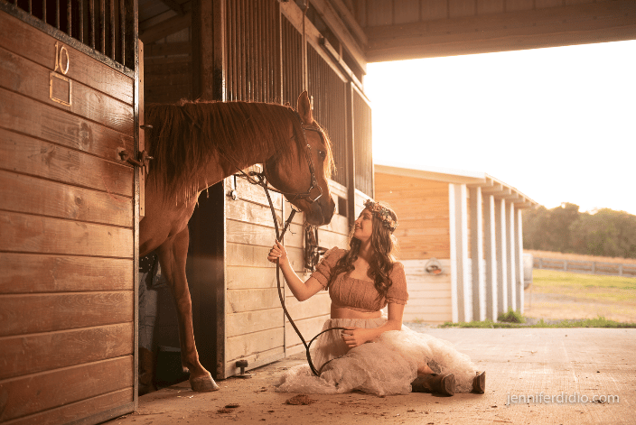 horse in stall and owner