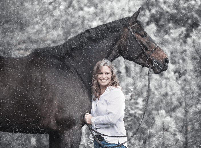 A mare and her owner in the snow