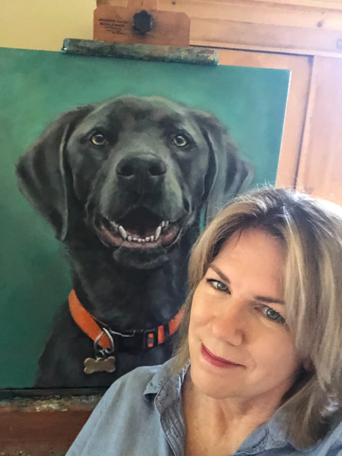 Julie Dalton Gourgues with recent commissioned portrait of a silver lab called Pepper.