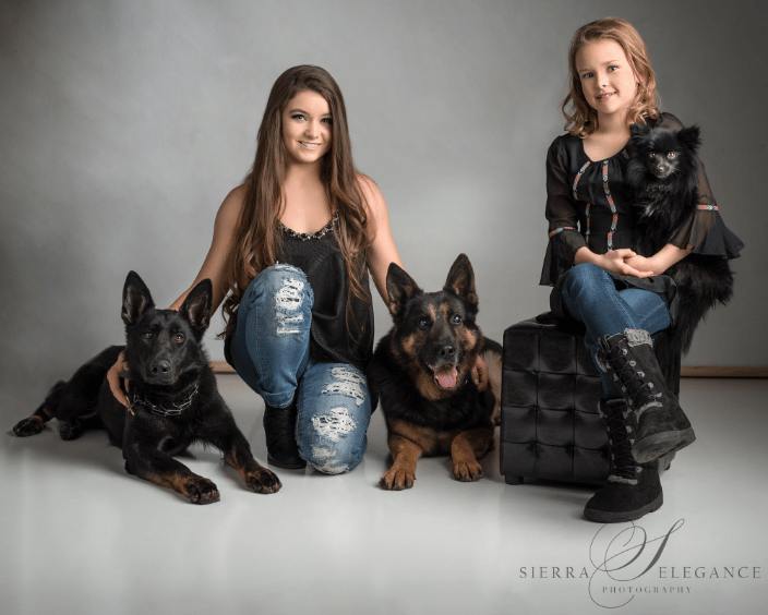 Girls and three dogs