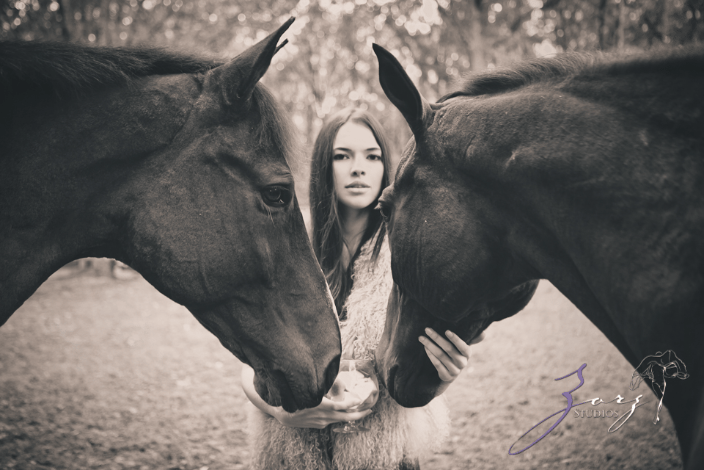 Young lady with two hourses