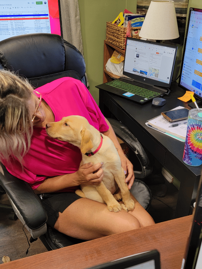 Our employee, Jazmyne, loving on a pup!