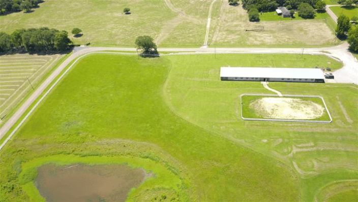 This is our 10 acre pasture with the barn, riding arena and pond.