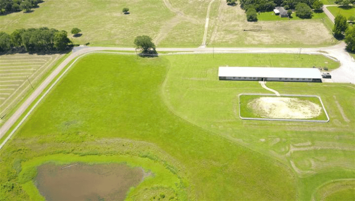 This is our 10 acre pasture with the barn, riding arena and pond.