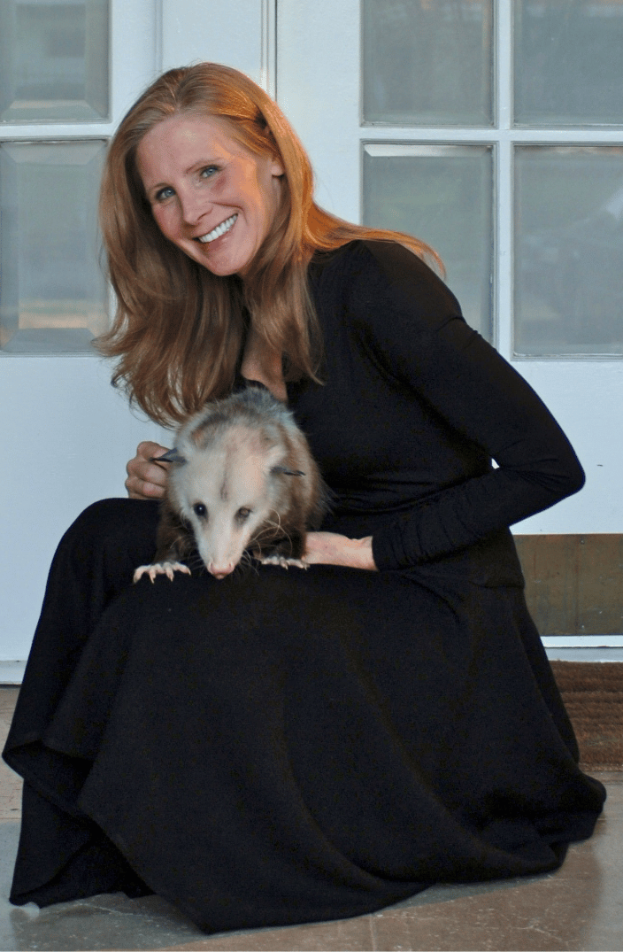Nancy with a rescued opossum she was rehabilitating.