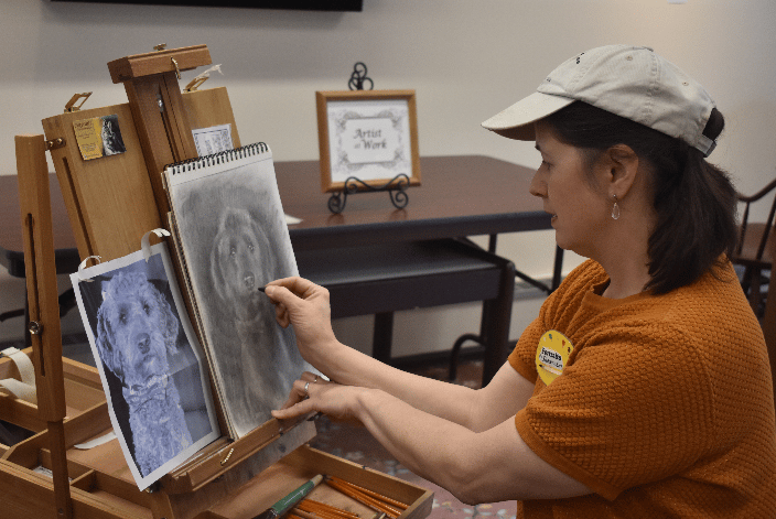 ShawnaLee demonstrates a Charcoal pet portrait at the Prospect Public Library May 2023 in front of a live audience. Photo credit Sarah Kwashnak with kind permission.