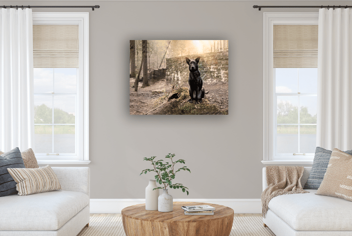 a large canvas with a black German Shepherd against a stone wall, in a lounge