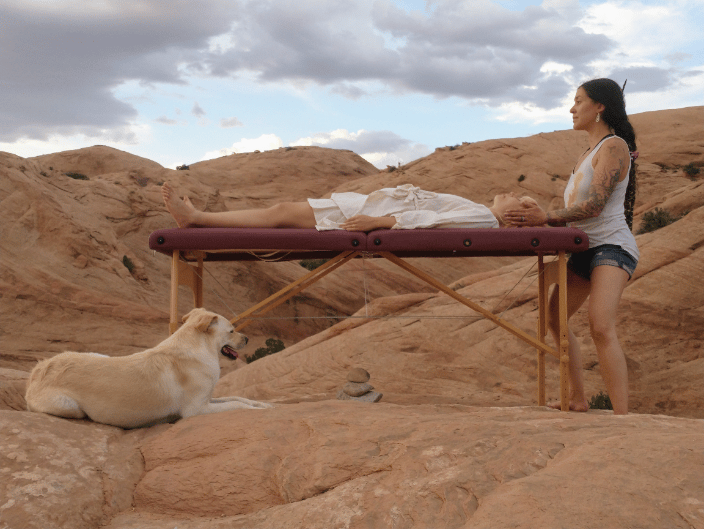 Me giving a Healing to a Human Client with my dog's help!