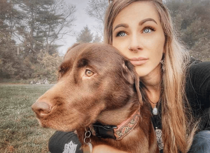 Hilary, Owner of Divine Creature Healing & her copilot, Juniper.