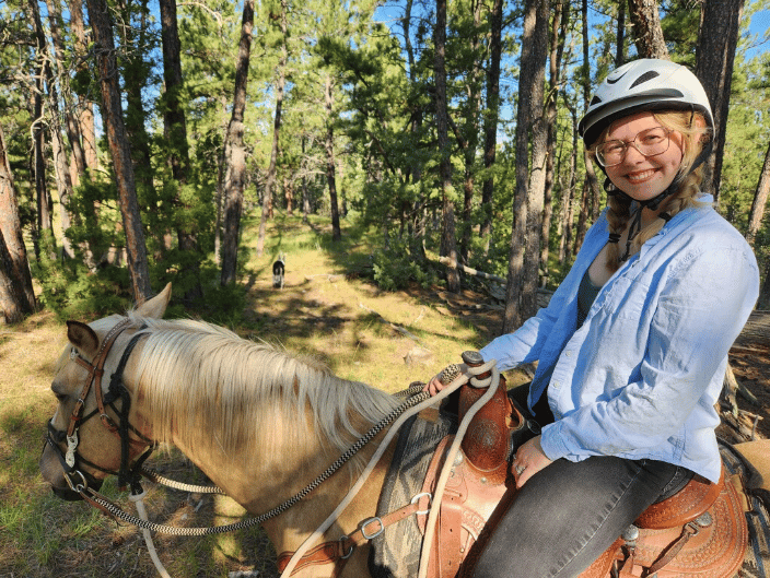 Riding a horse in the Black Hills of SD