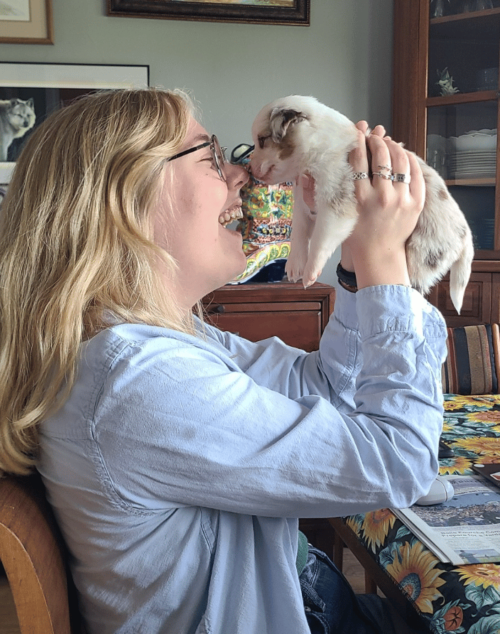 Loving up on one of Bluegrass Kennel's puppies