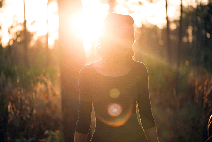 Woman with light behind her
