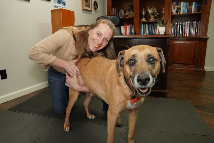 Dr. Peterson adjusting a dog