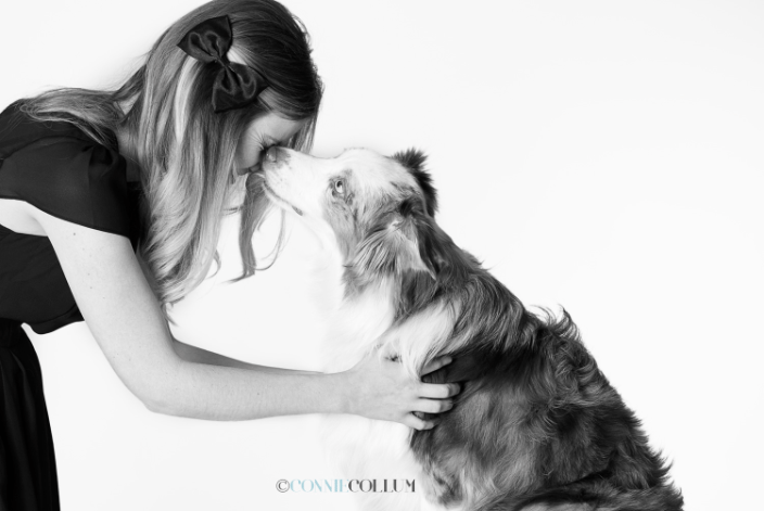 Young woman with Australian Shepherd