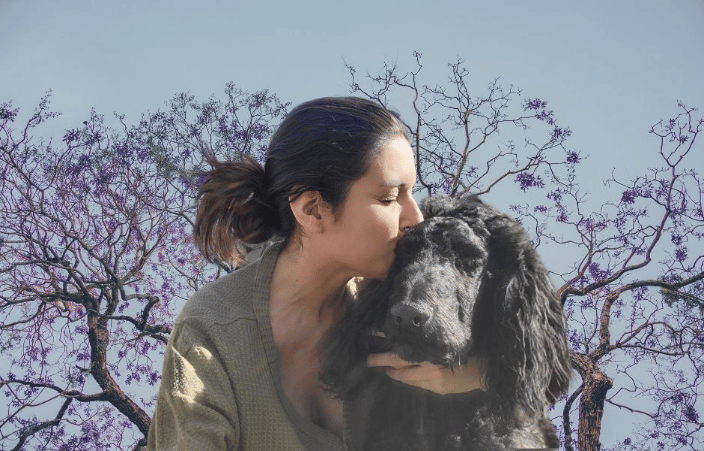 Veronica Dennis kissing her dog